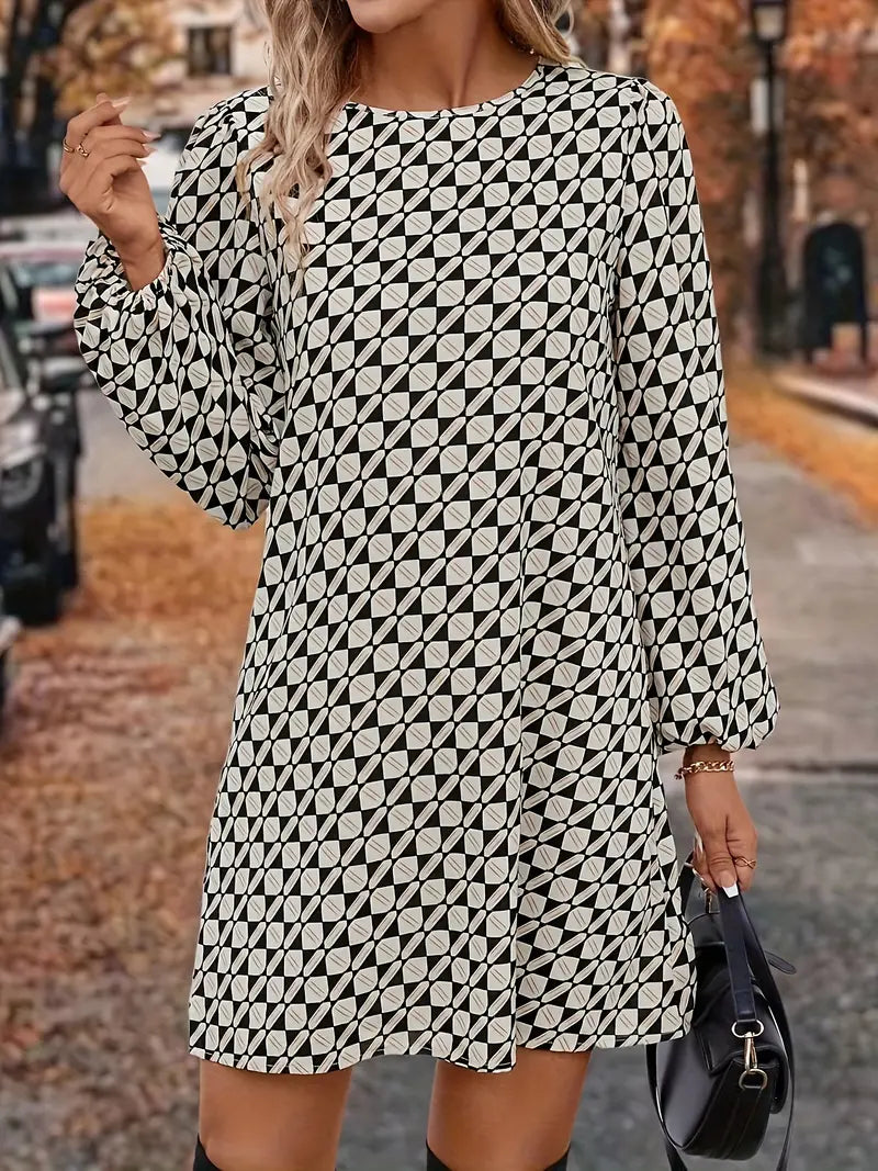 Abito sofisticato con maniche a lanterna e fantasia geometrica