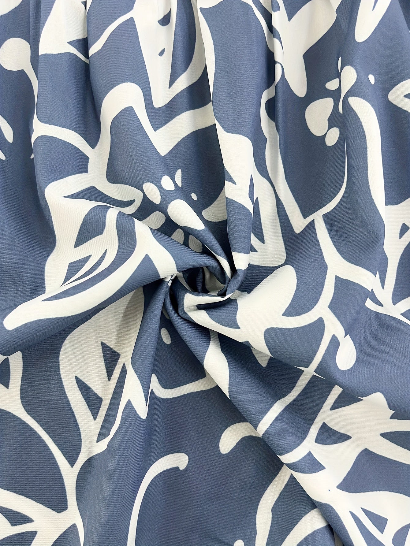 Abito a canotta con orlo a balze e stampa floreale, scollo a V senza maniche