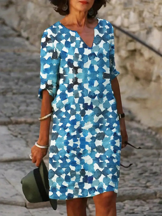 Abito blu con stampa all-over, scollatura a V e maniche a mezza lunghezza