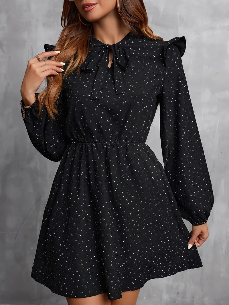 Abito a maniche lunghe con scollo a cravatta e stampa floreale senza tempo