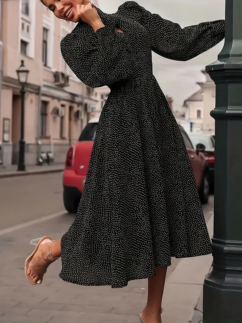 Elegante abito midi con maniche a lanterna e pois