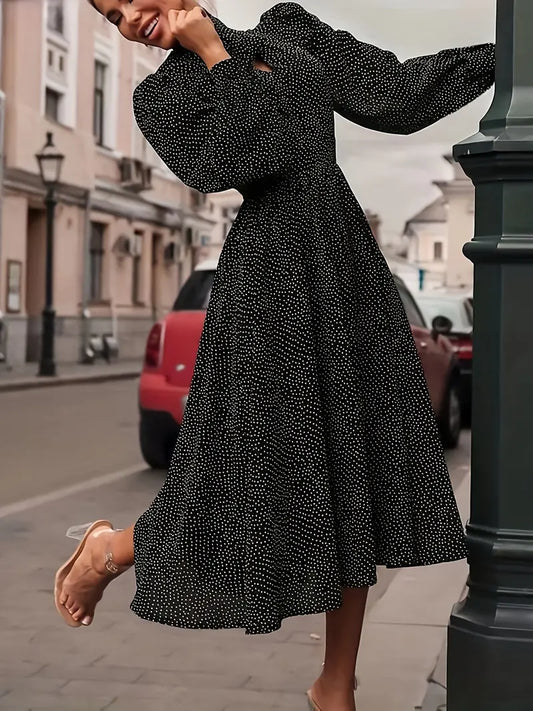 Elegante abito midi con maniche a lanterna e pois