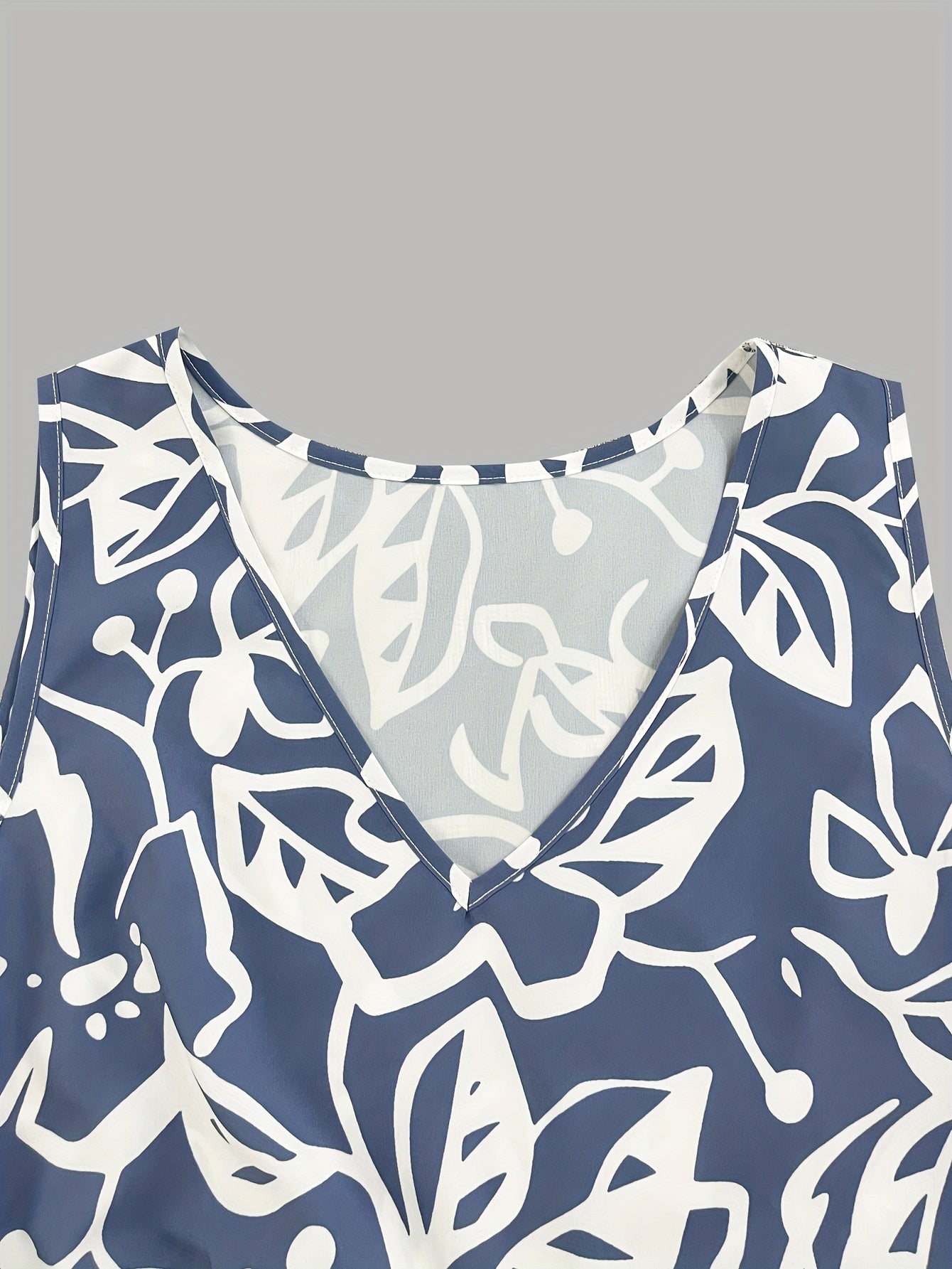 Abito a canotta con orlo a balze e stampa floreale, scollo a V senza maniche