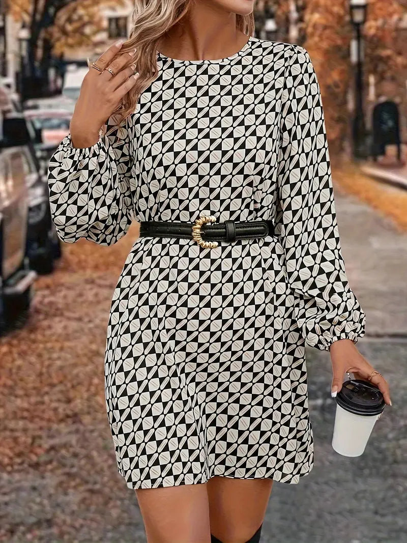 Abito sofisticato con maniche a lanterna e fantasia geometrica