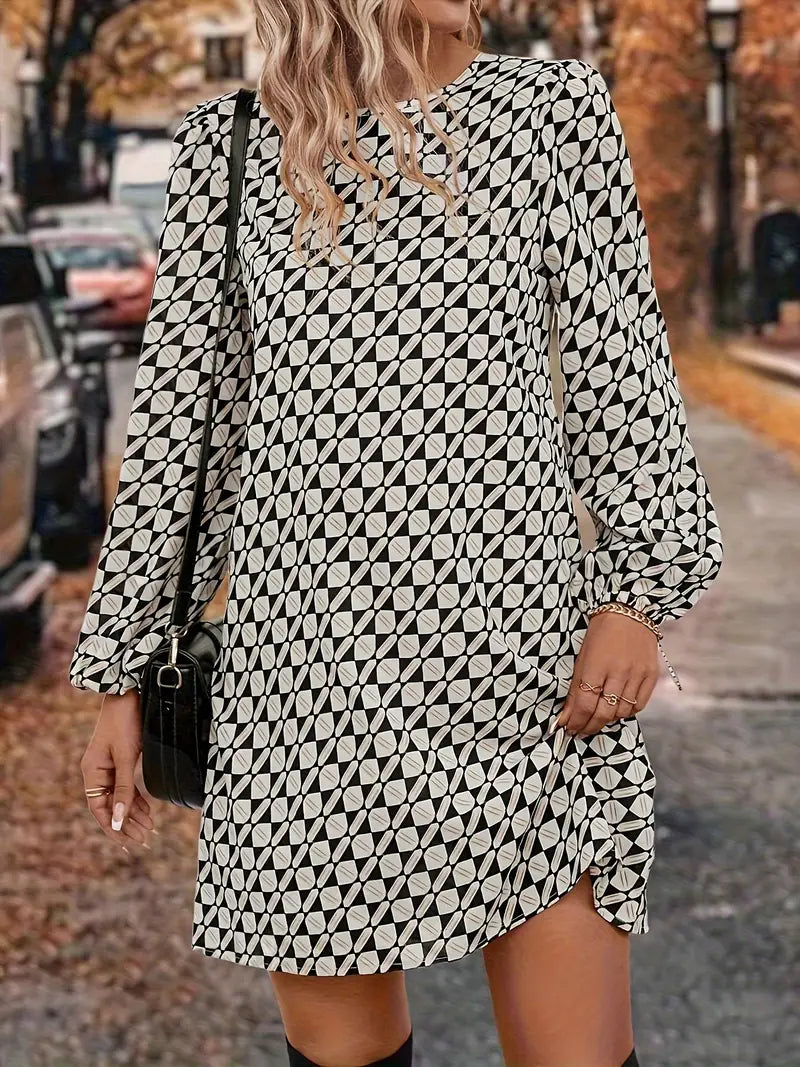 Abito sofisticato con maniche a lanterna e fantasia geometrica