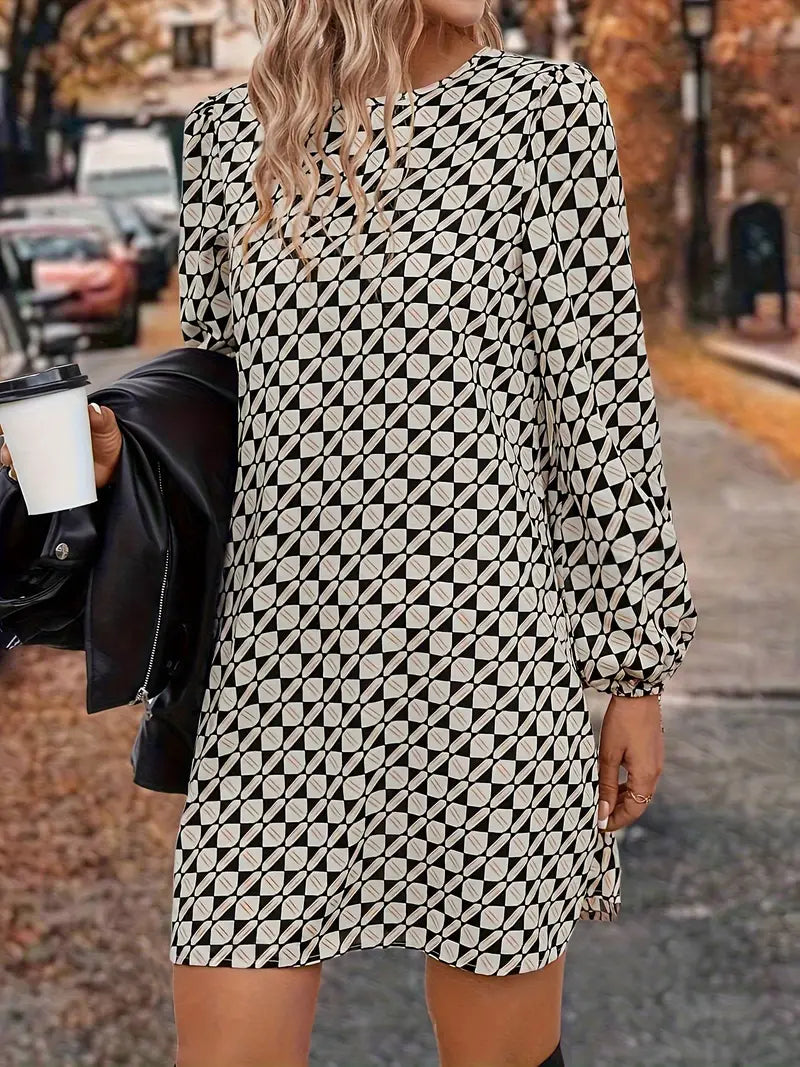 Abito sofisticato con maniche a lanterna e fantasia geometrica