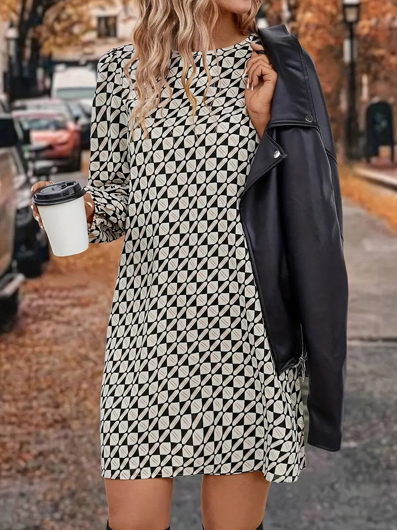 Abito sofisticato con maniche a lanterna e fantasia geometrica