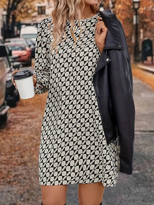 Abito sofisticato con maniche a lanterna e fantasia geometrica